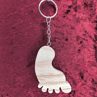 Voici un joli porte-clés d’un pied en éventail en bois noble