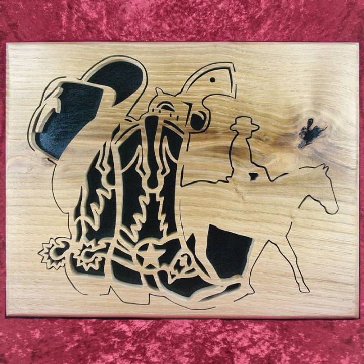 Tableau en bois noble d’un cowboy avec chapeau, colts et santiags
