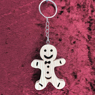 Voici un joli porte-clés d’un bonhomme en pain d'épice en bois noble