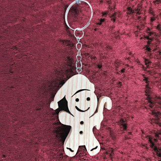 Voici un porte-clés d’un lutin avec une canne à sucre en bois noble
